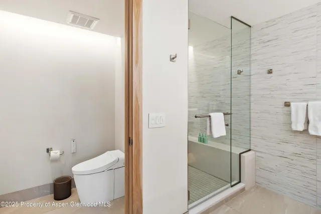 a bathroom with a sink double vanity and a mirror