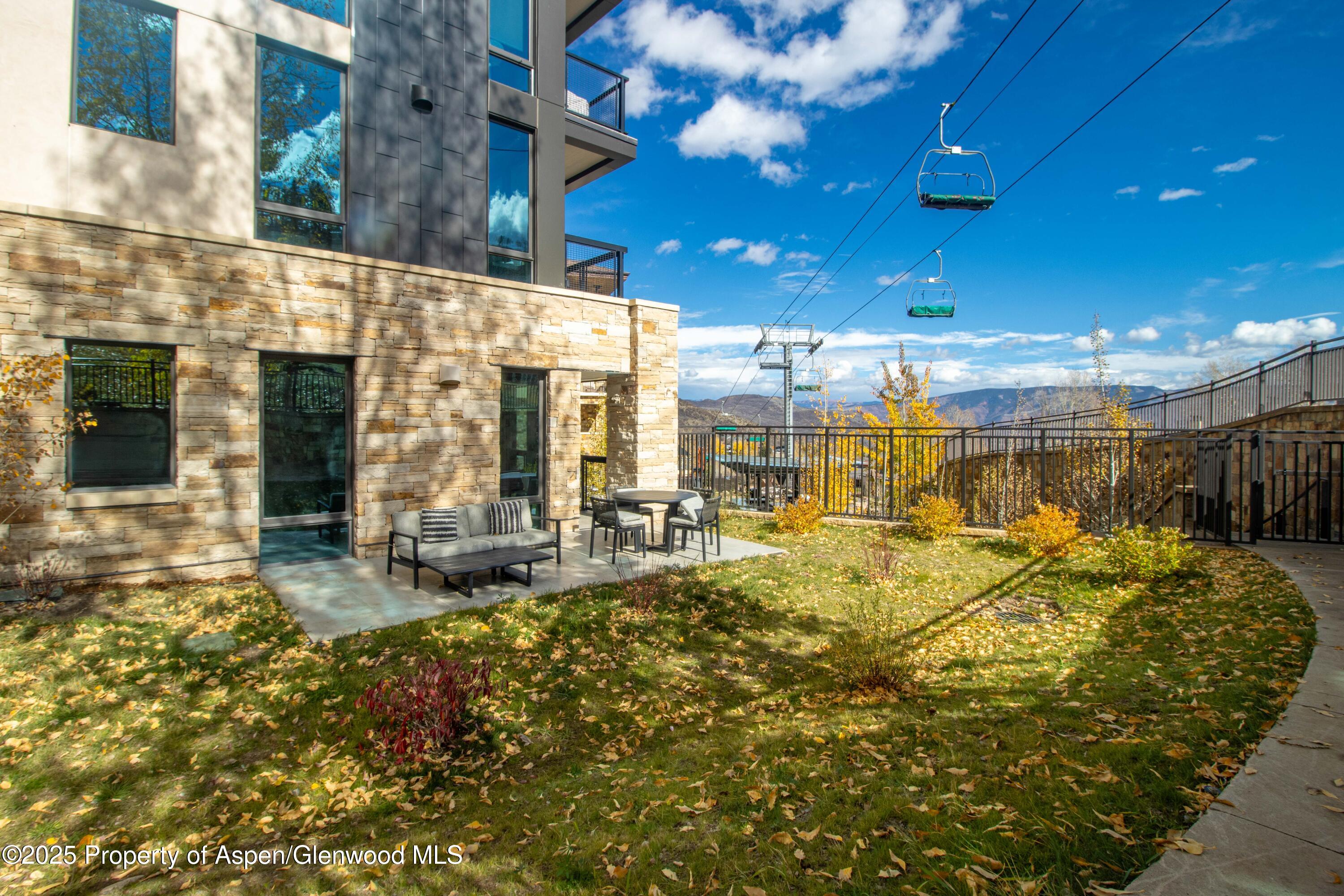 130 Wood Road, Unit 151 Snowmass Village, CO 81615 - Photo 14 of 16 a view of a swimming pool with outdoor seating