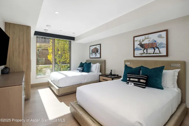 a bathroom with a sink toilet vanity and tub