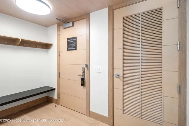 a kitchen with a stove and a wooden floors