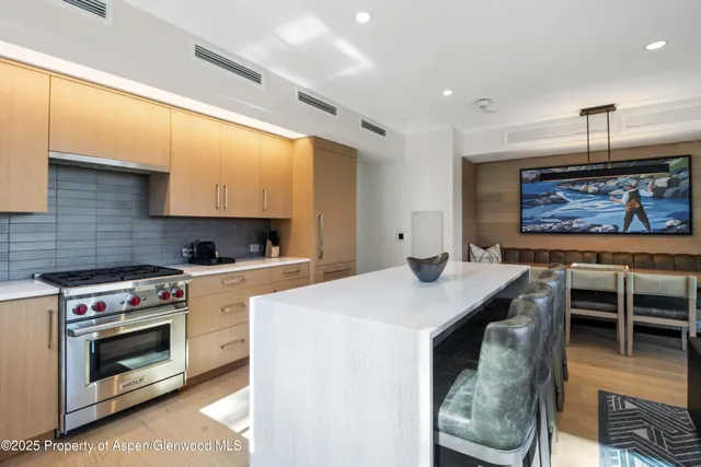 a kitchen with a sink and a stove top oven