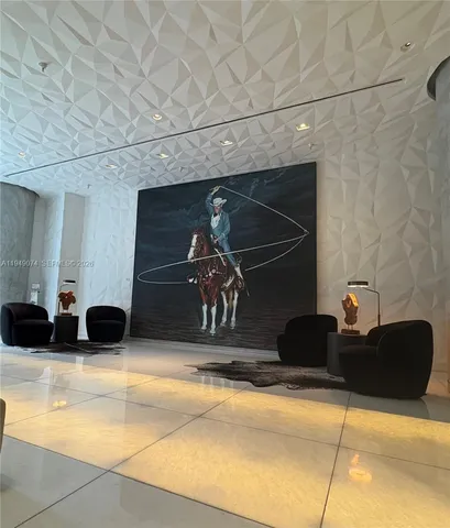 a room with two black chairs