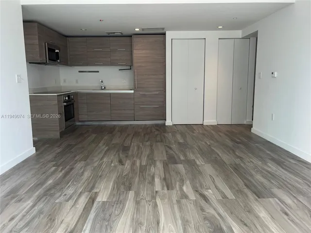 a view of kitchen with wooden floor