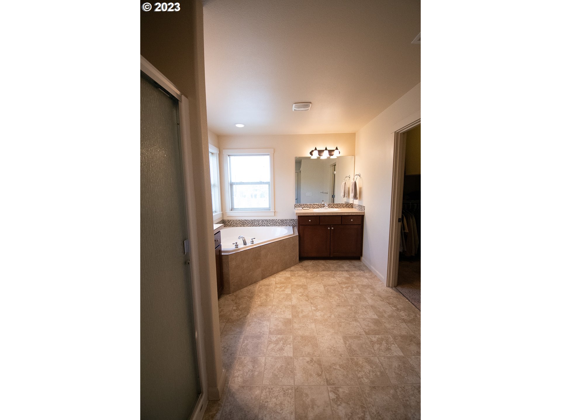 4309 North 4th Circle Ridgefield, WA 98642 - Photo 11 of 24 a view of a living room with bathroom and a sink