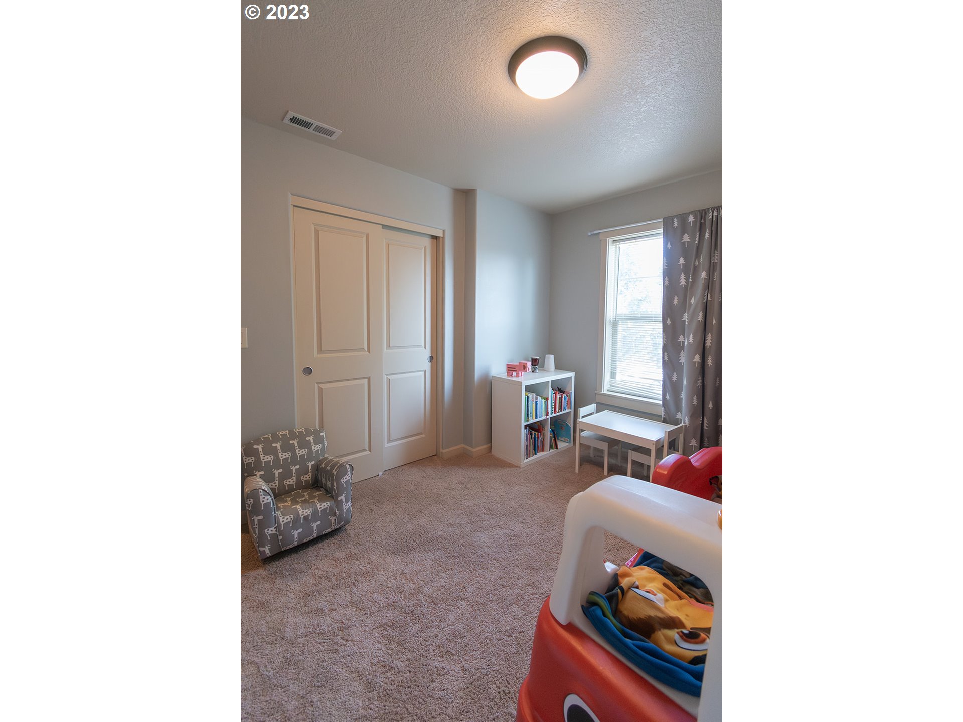 4309 North 4th Circle Ridgefield, WA 98642 - Photo 18 of 24 a living room with furniture and a window