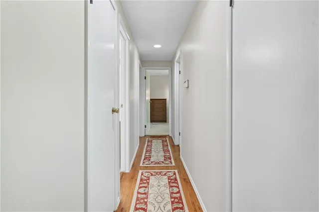 a view of a hallway with white walls