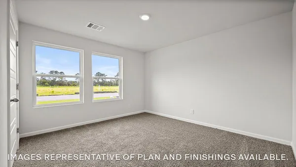 a view of an empty room and a window