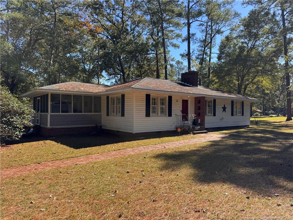1108 North Fulton Street Raeford, NC 28376 - Photo 2 of 13 Front side showing screen porch