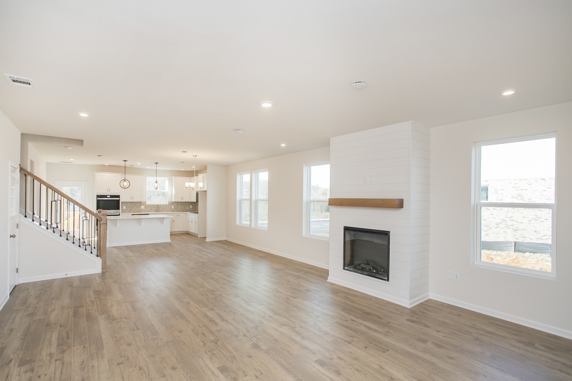 1308 Godwin Road Hermitage, TN 37076 - Photo 12 of 45 a view of an empty room with wooden floor fireplace and a window