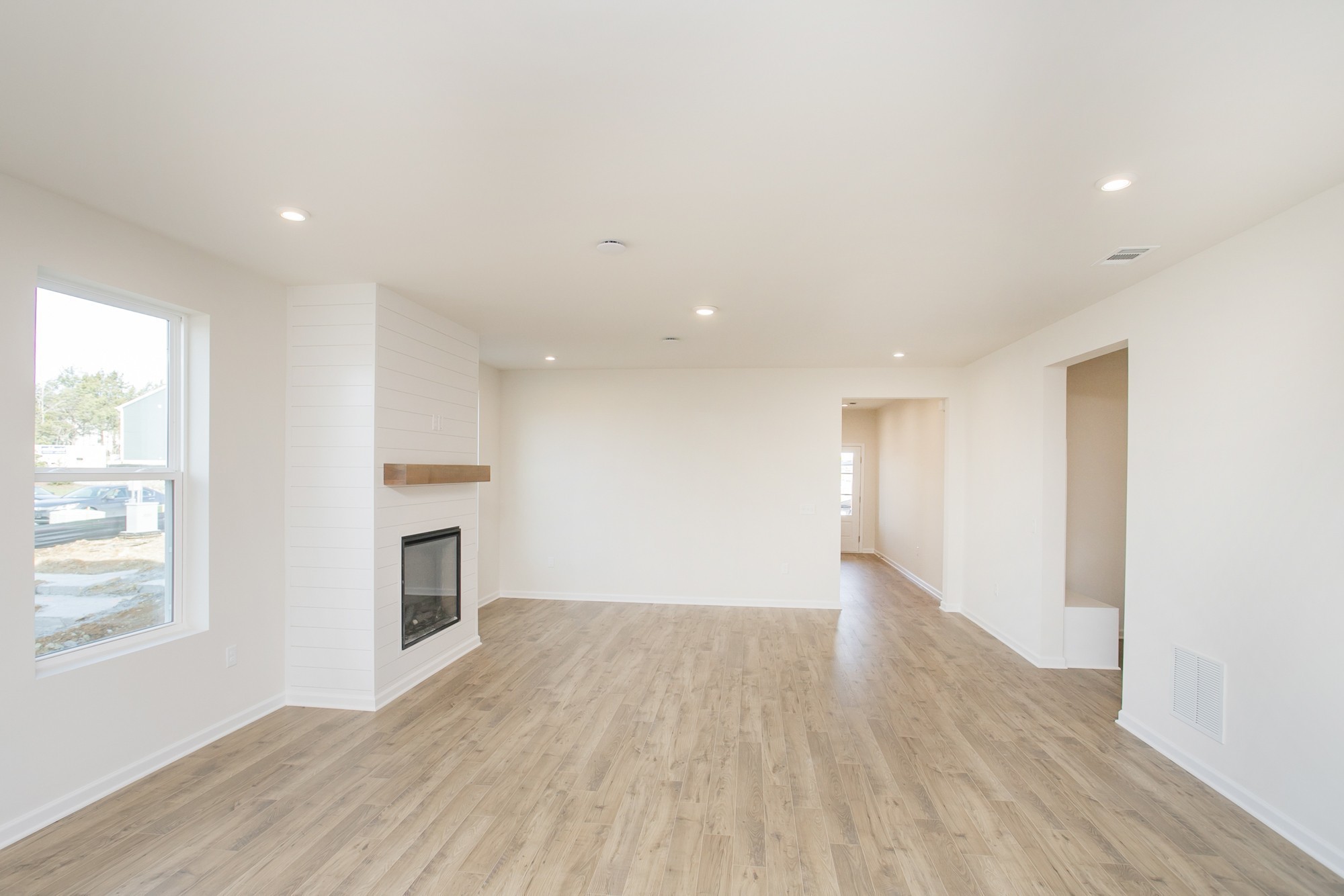 1308 Godwin Road Hermitage, TN 37076 - Photo 14 of 45 a view of empty room with wooden floor and fireplace