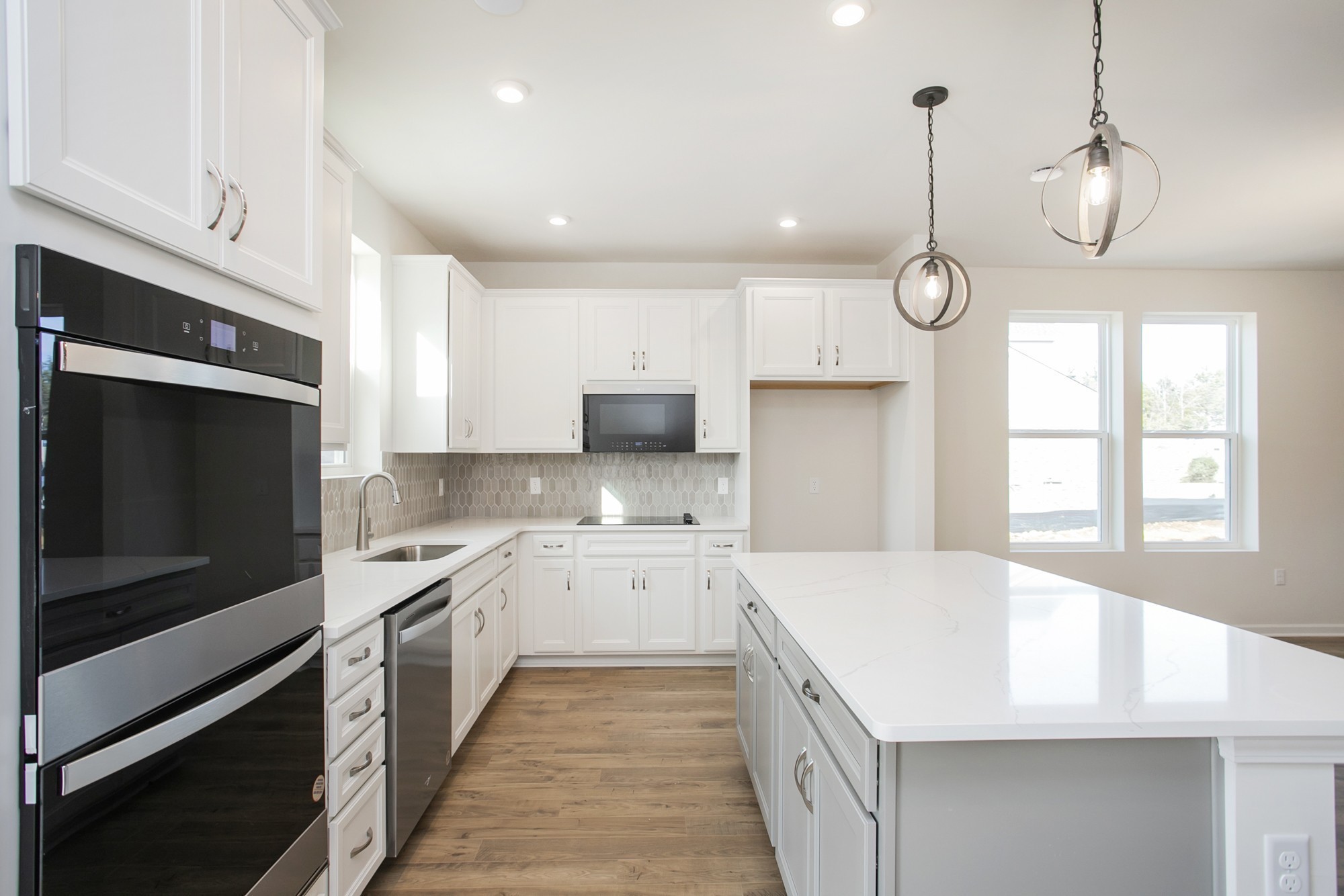 1308 Godwin Road Hermitage, TN 37076 - Photo 15 of 45 a large kitchen with stainless steel appliances kitchen island granite countertop a sink and dishwasher a stove top oven with wooden floor