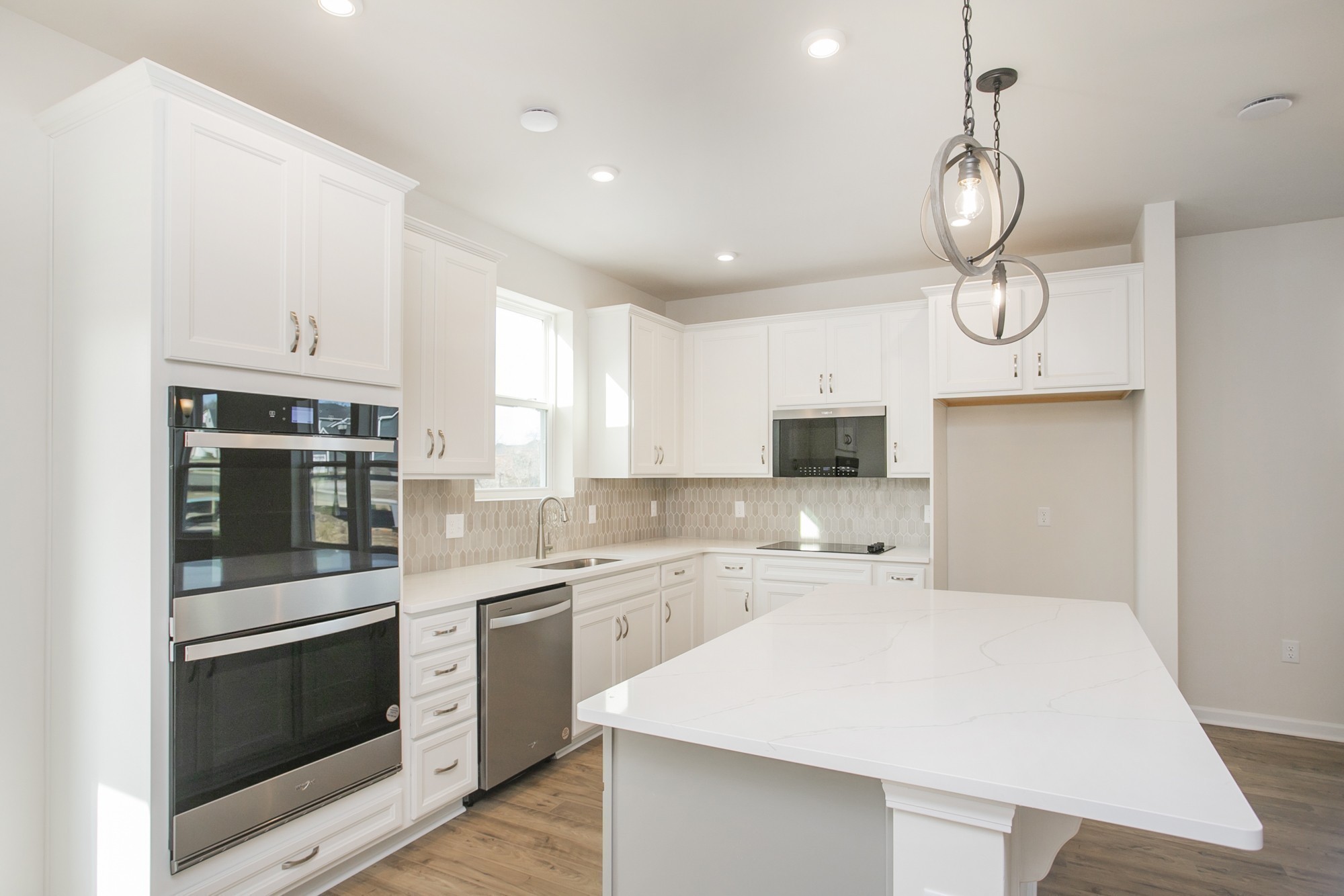 1308 Godwin Road Hermitage, TN 37076 - Photo 16 of 45 a kitchen with stainless steel appliances a stove a sink and cabinets