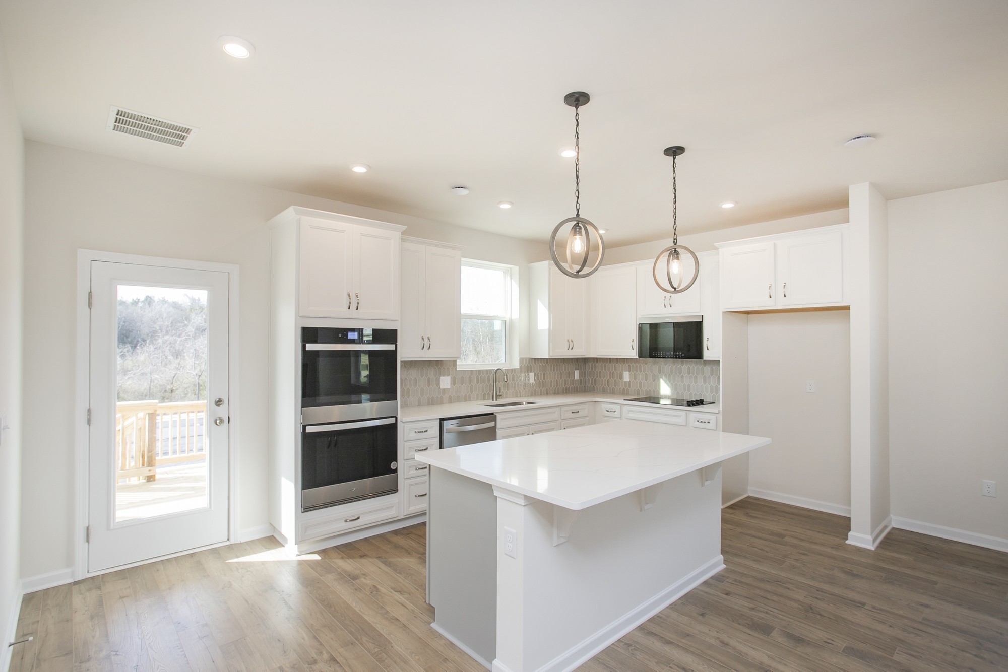 1308 Godwin Road Hermitage, TN 37076 - Photo 17 of 45 a large kitchen with kitchen island a large island a sink stainless steel appliances and cabinets