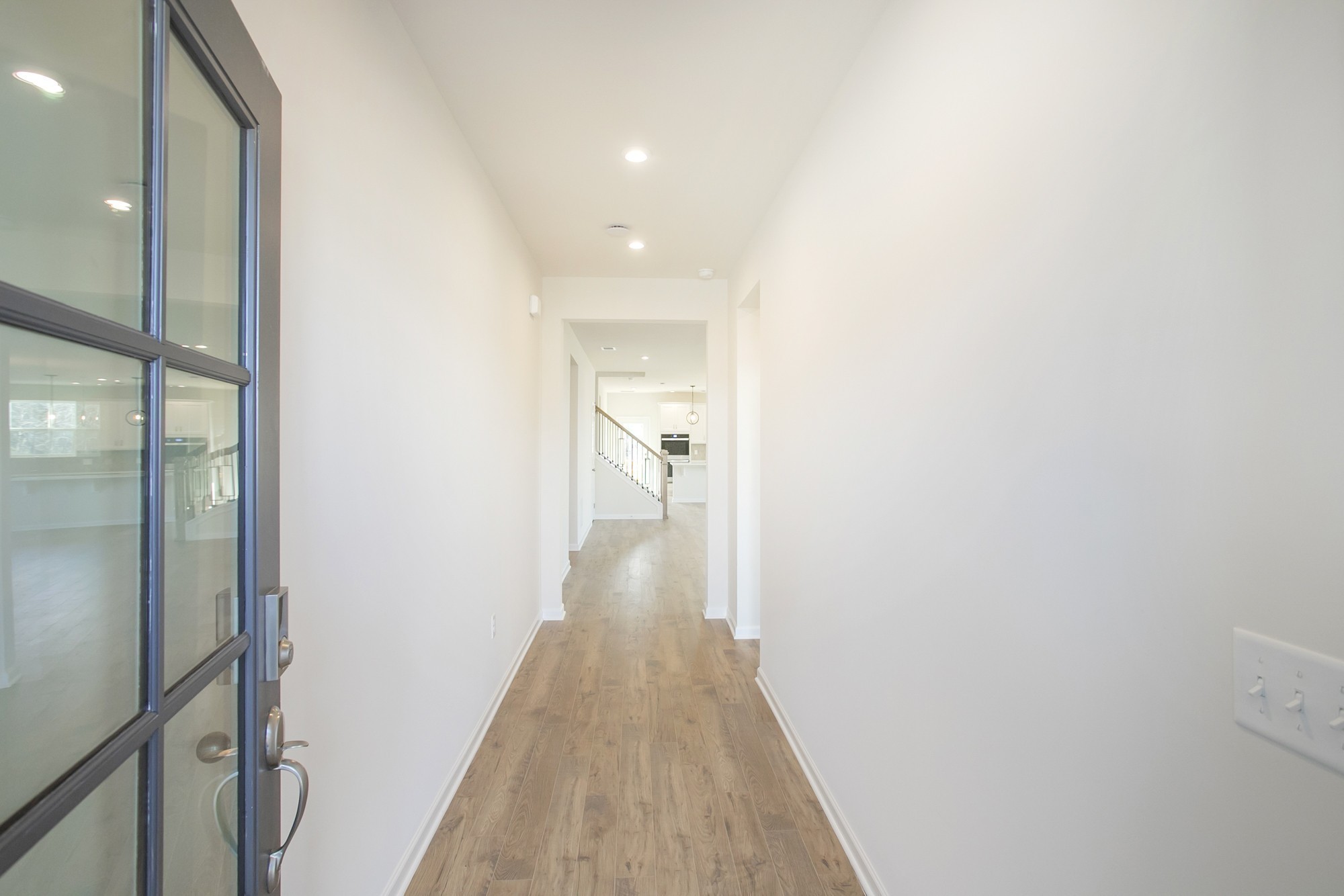 1308 Godwin Road Hermitage, TN 37076 - Photo 9 of 45 a view of a hallway with wooden floor and staircase