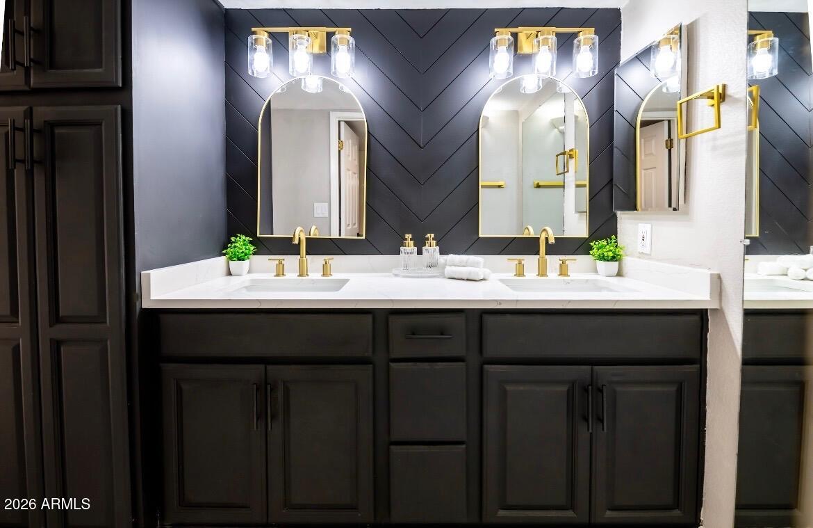 4303 East Cactus Road, Unit 128 Phoenix, AZ 85032 - Photo 9 of 39 a bathroom with a double vanity sink and a mirror