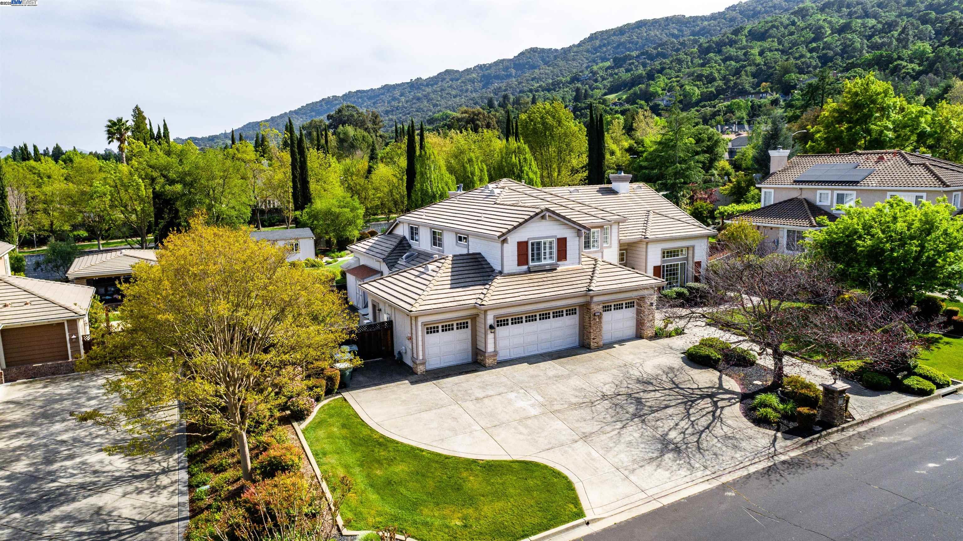 a view of a house with a yard balcony and sitting area