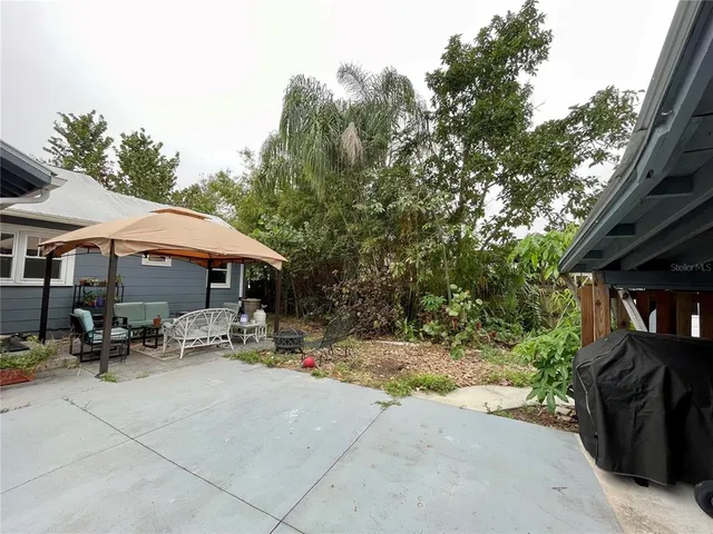 a front view of a house with a garden and porch