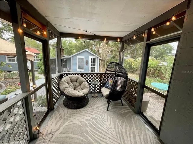 a view of living room with furniture and a large window