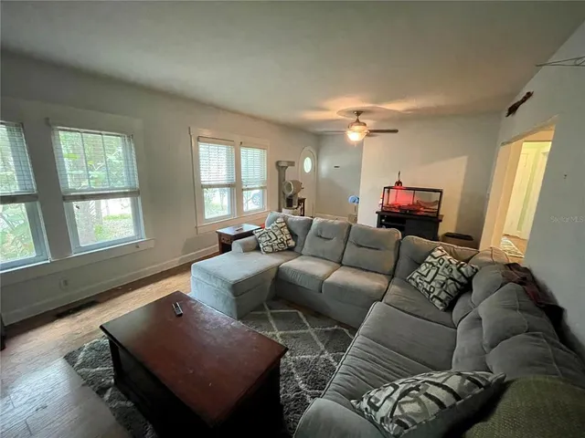a living room with furniture and a window