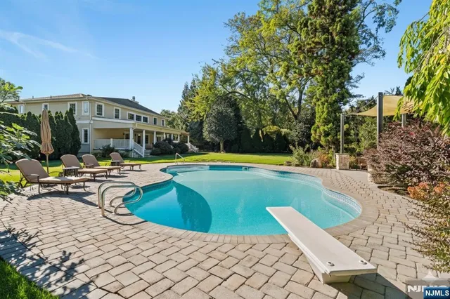 a building outdoor space with patio furniture and potted plants