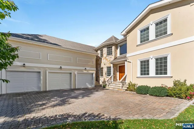 a front view of a house with garden and porch