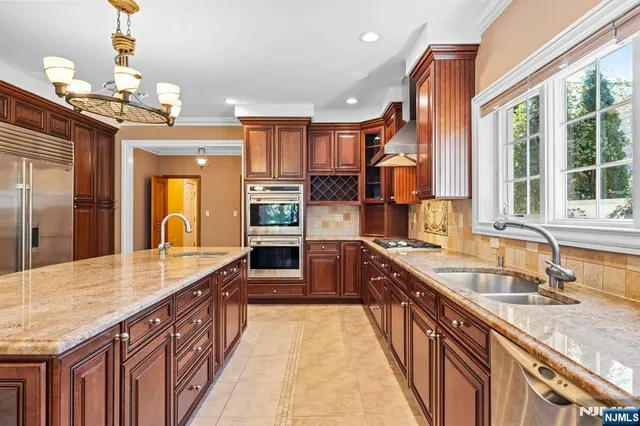 a large kitchen with kitchen island granite countertop a large island in the center