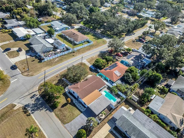 an aerial view of residential houses with outdoor space
