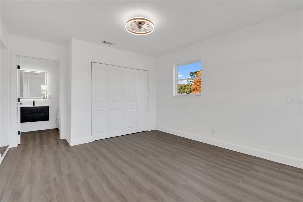 11598 Ridge Road Largo, FL 33778 - Photo 10 of 29 a view of empty room with wooden floor