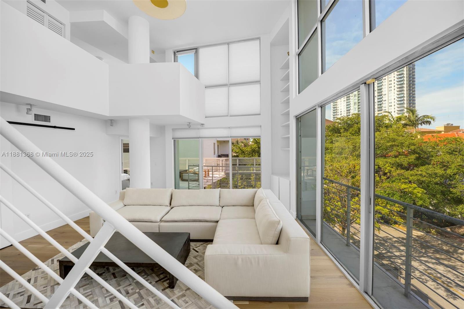 221 Jefferson Avenue, Unit 10 Miami Beach, FL 33139 - Photo 4 of 17 a living room with furniture a large window with outer view