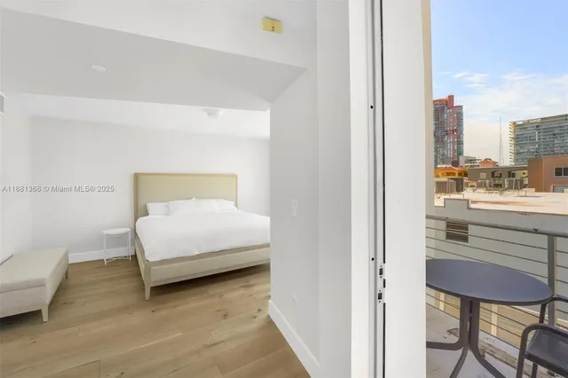 a bedroom with a bed and a chair