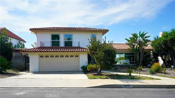 a front view of house with garage