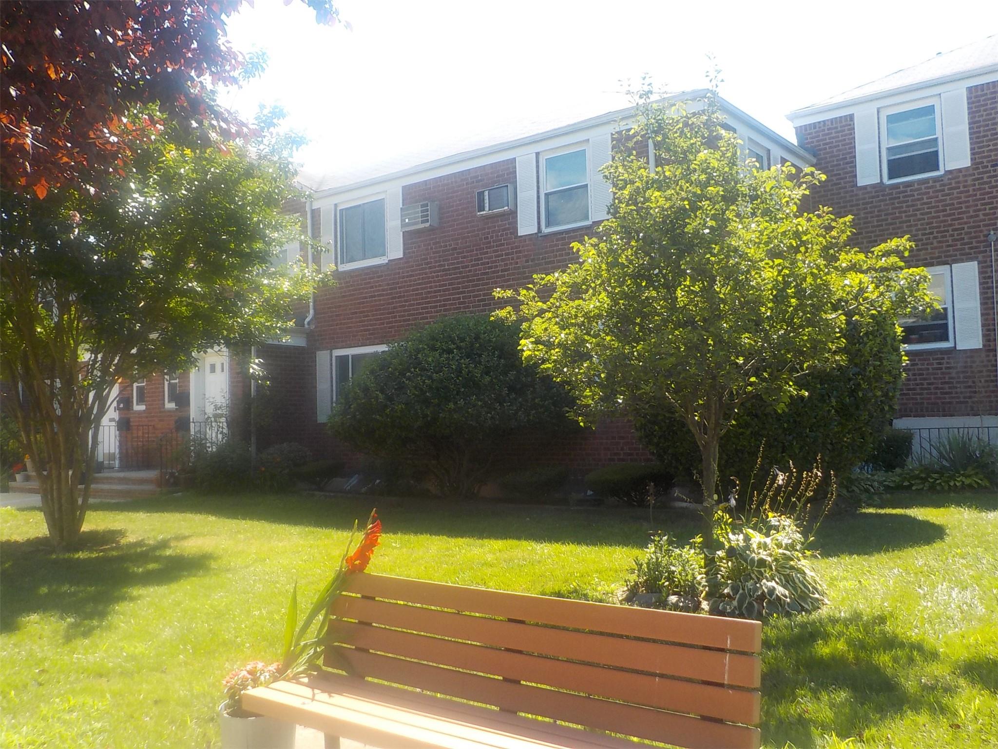 70-50 260th Street, Unit H2 Queens, NY 11004 - Photo 1 of 1 a view of a house with a yard