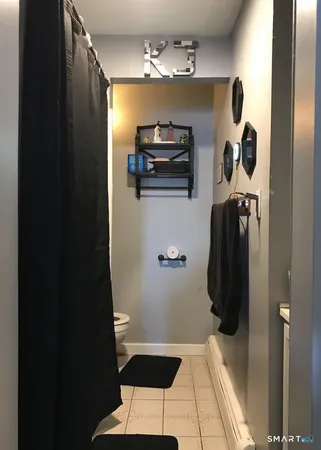 a bathroom with a shower and a sink