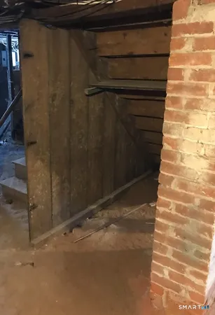 a room with gym equipment and a fireplace