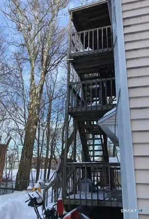 a view of a house with a tree