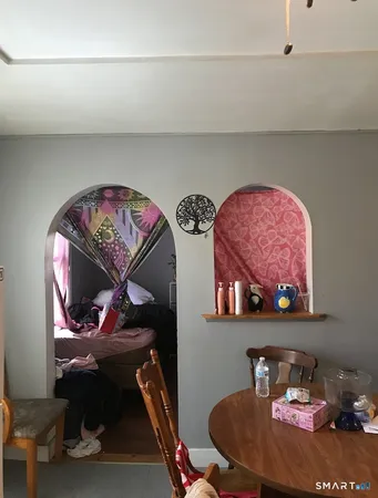 a room with furniture and wooden floor