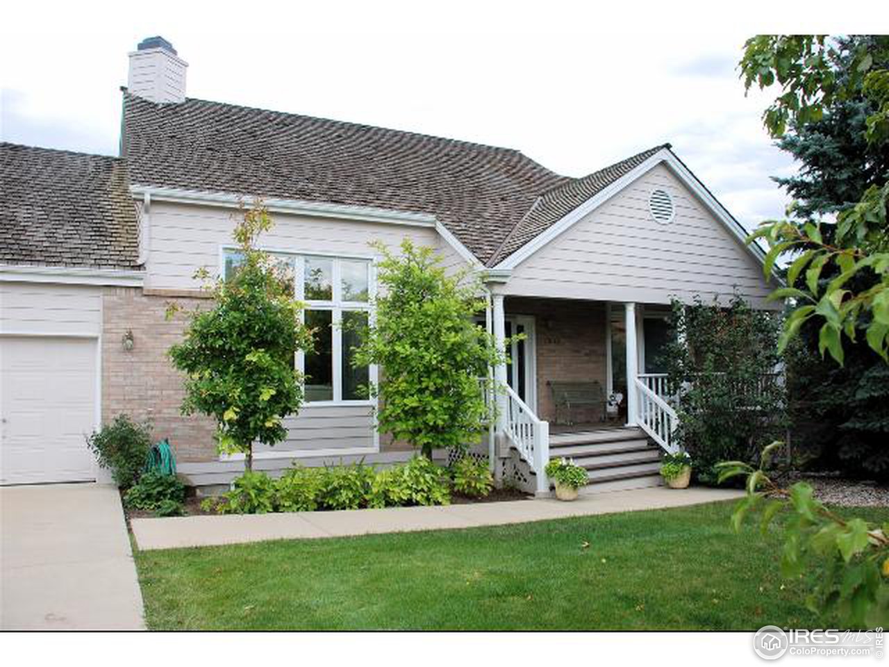 7233 Four Rivers Road Boulder, CO 80301 - Photo 1 of 12 a front view of a house with a garden