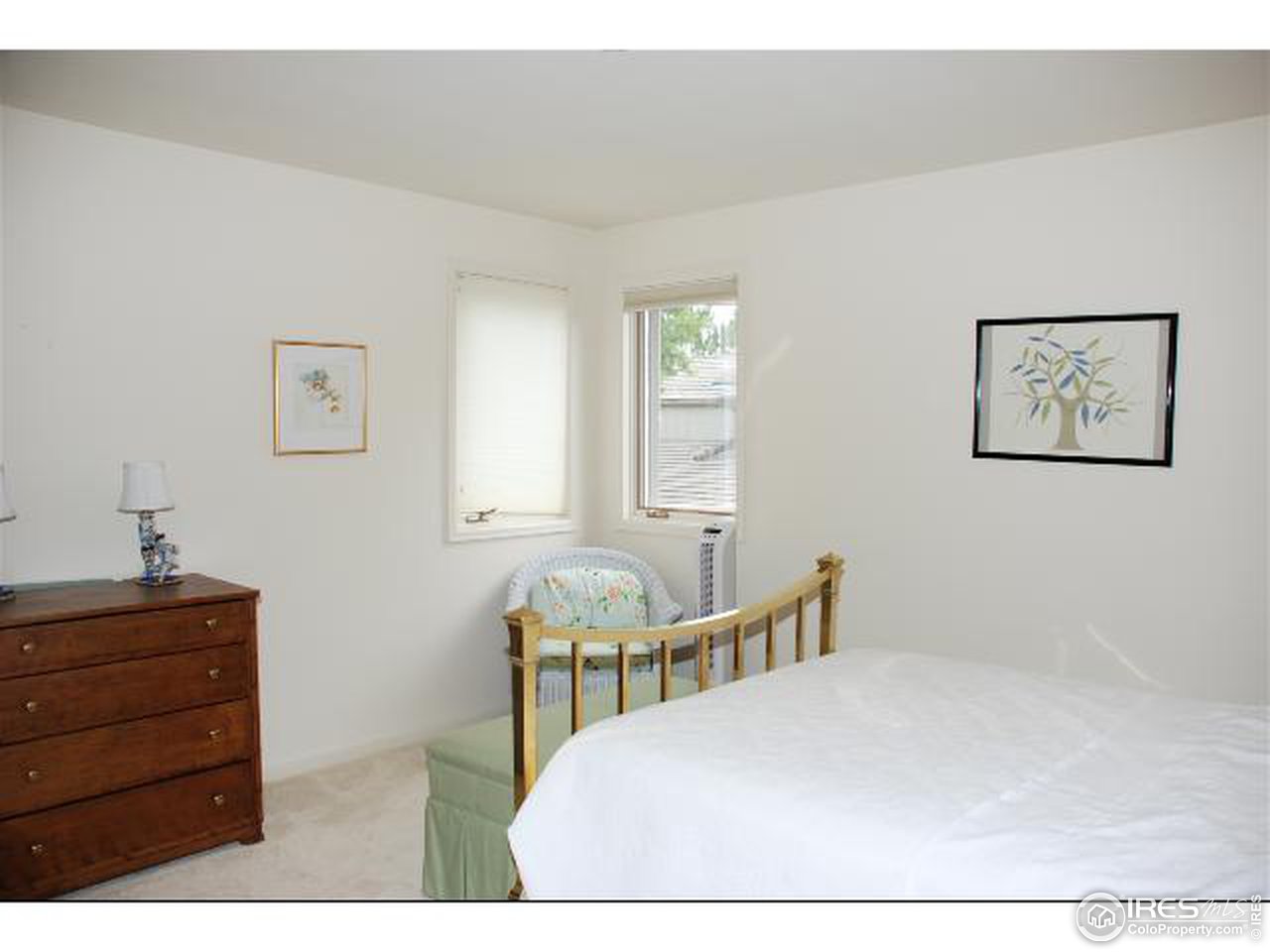 7233 Four Rivers Road Boulder, CO 80301 - Photo 12 of 12 a bedroom with a bed a dresser and a window