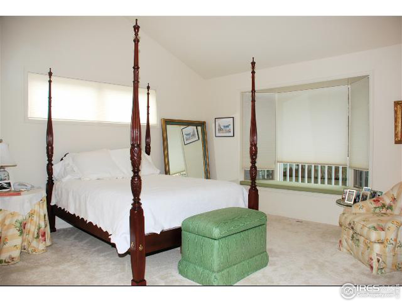 7233 Four Rivers Road Boulder, CO 80301 - Photo 6 of 12 a bedroom with a bed window and a night stand