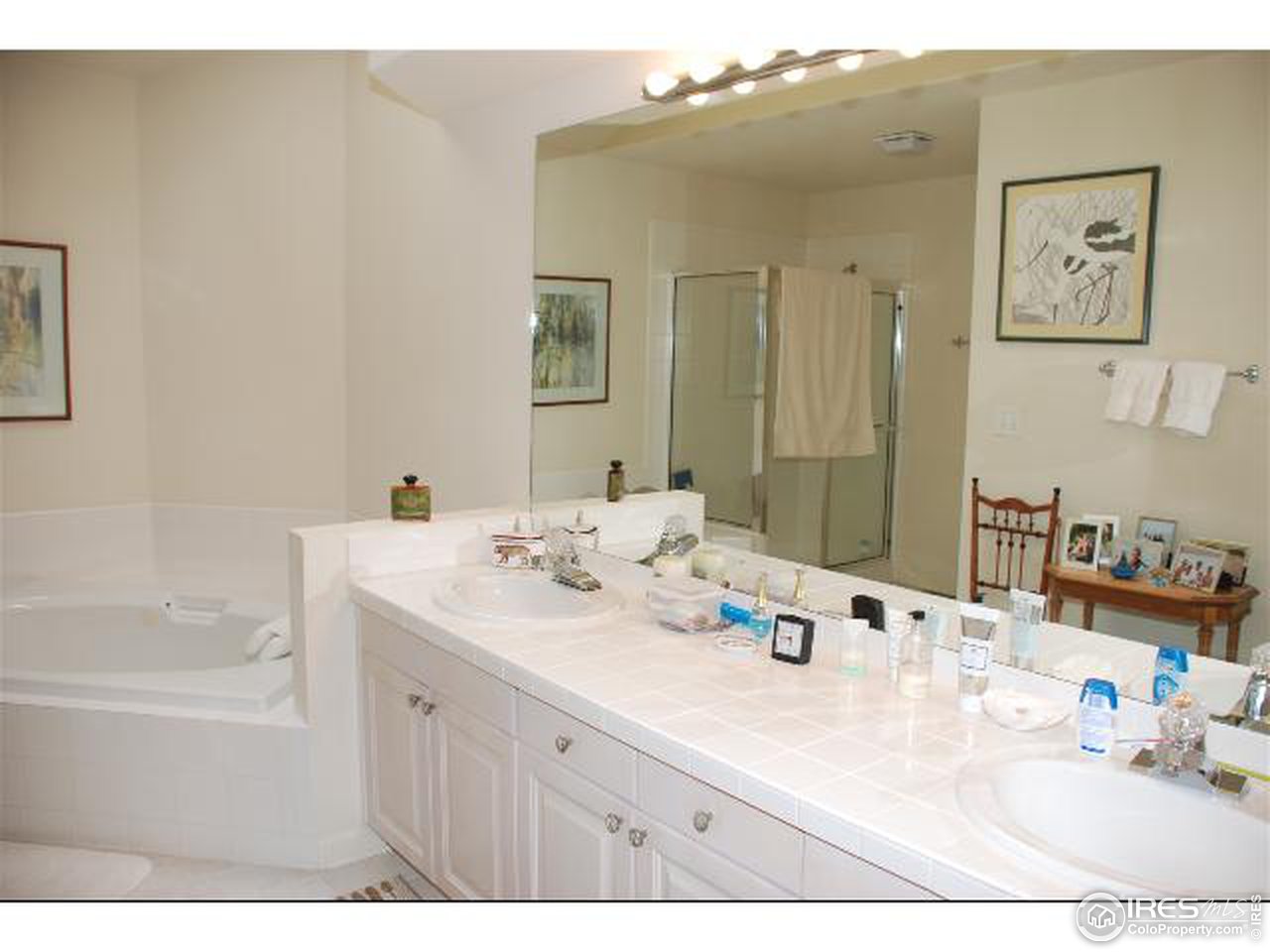 7233 Four Rivers Road Boulder, CO 80301 - Photo 10 of 12 a bathroom with a tub sink and mirror