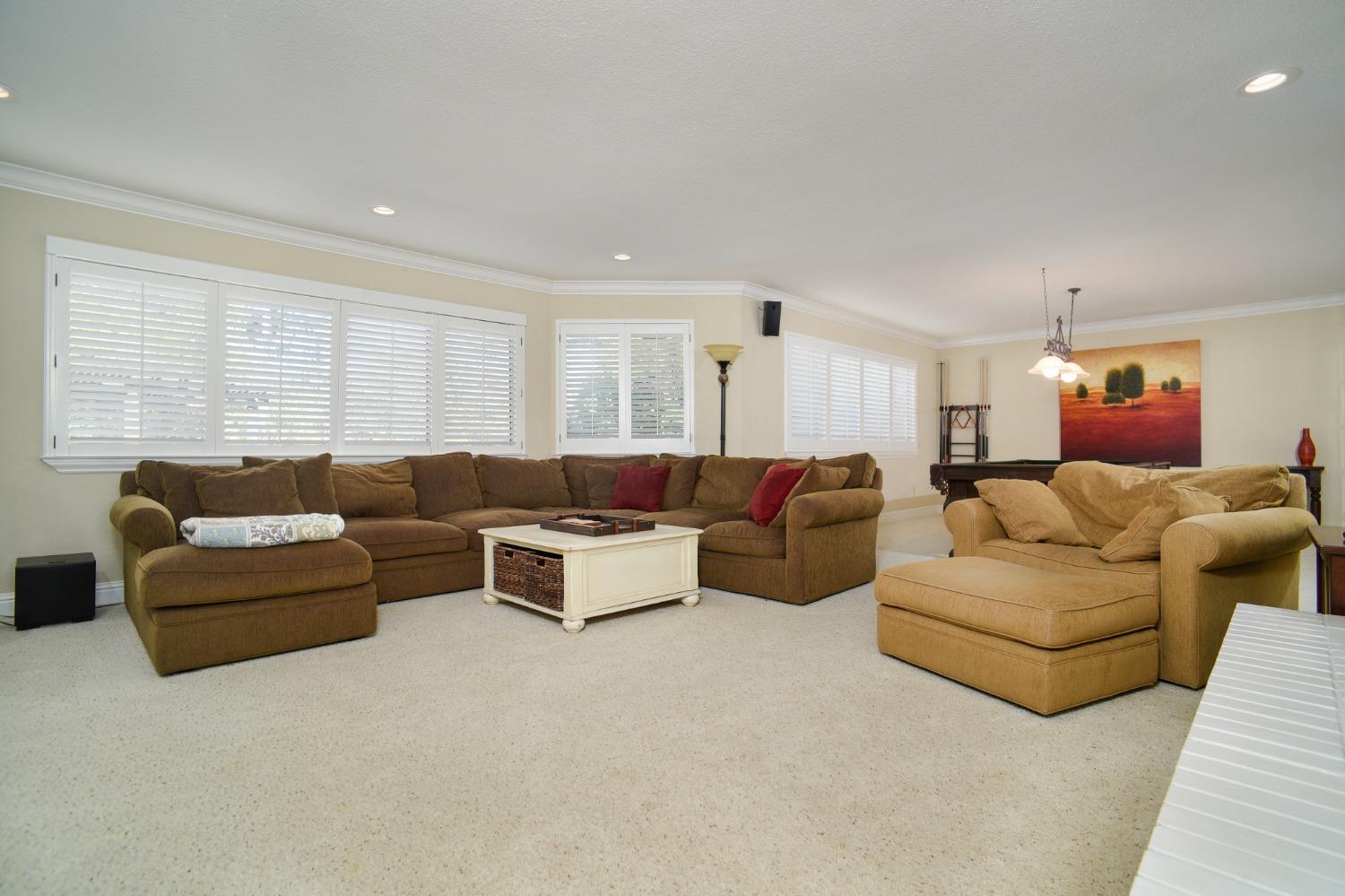 8720 Tavernor Road Wilton, CA 95693 - Photo 17 of 83 a living room with furniture and a large window