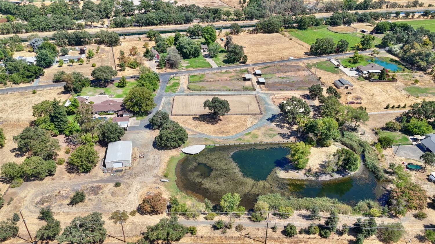 8720 Tavernor Road Wilton, CA 95693 - Photo 58 of 83 an aerial view of a house with a yard and lake view