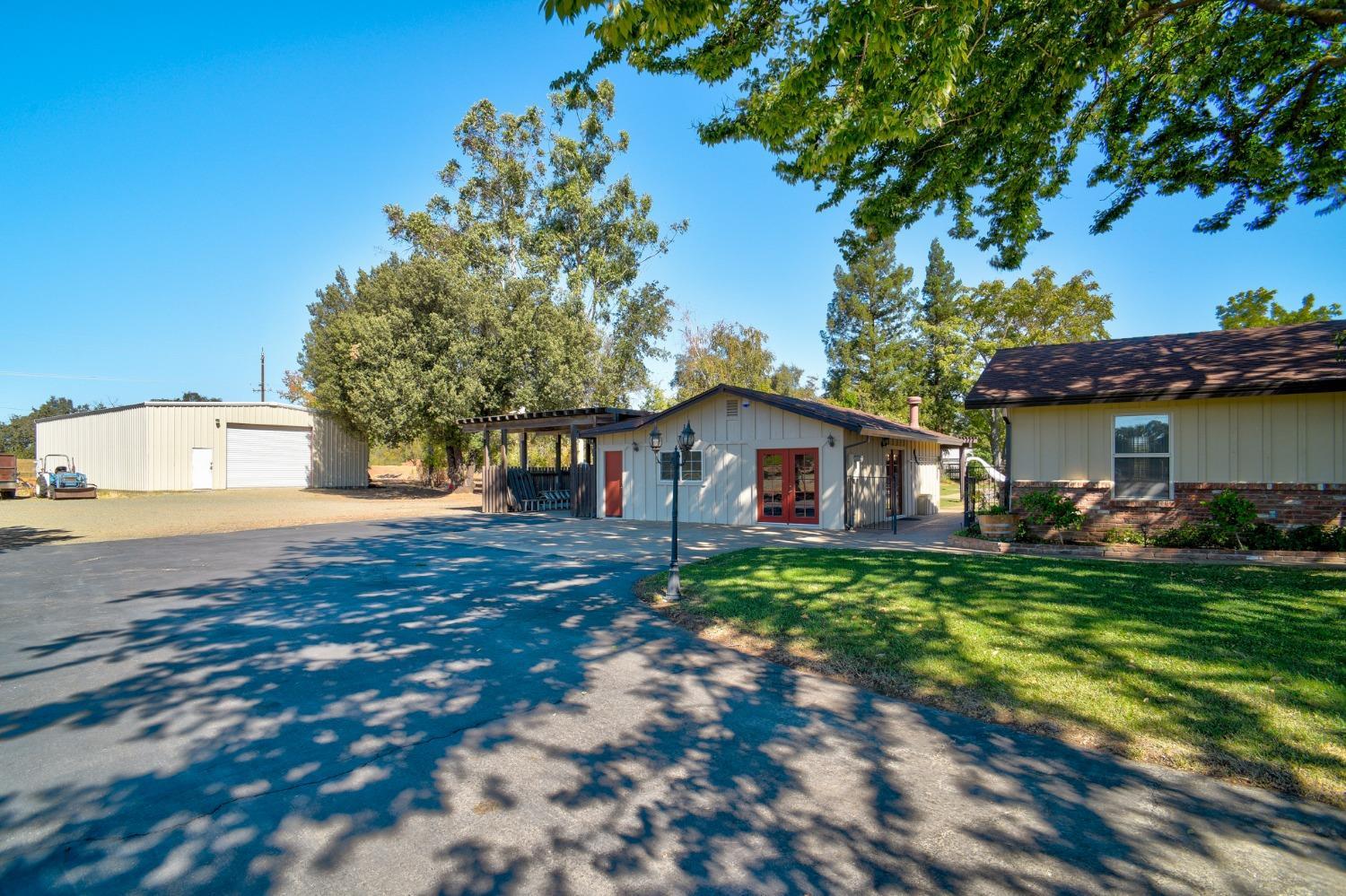 8720 Tavernor Road Wilton, CA 95693 - Photo 6 of 83 a front view of a house with garden