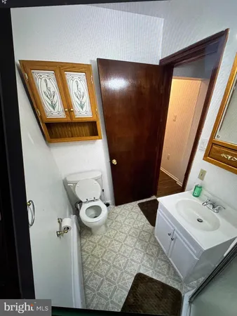 a bathroom with a bathtub and a mirror