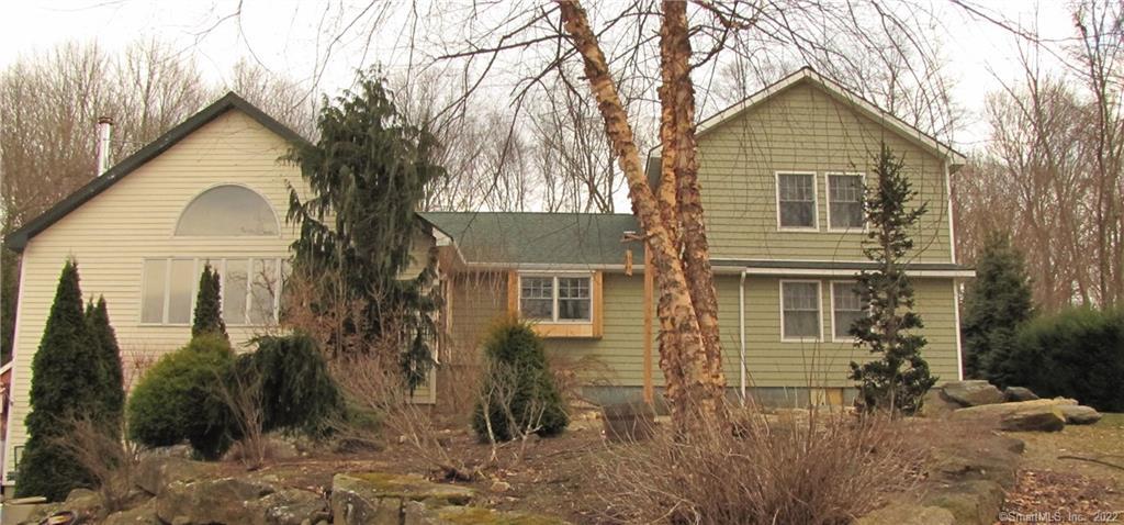18 Turkey Roost Road Monroe, CT 06468 - Photo 1 of 1 a front view of a house with garden
