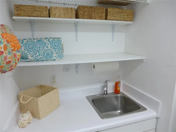 a kitchen with a sink and cabinets