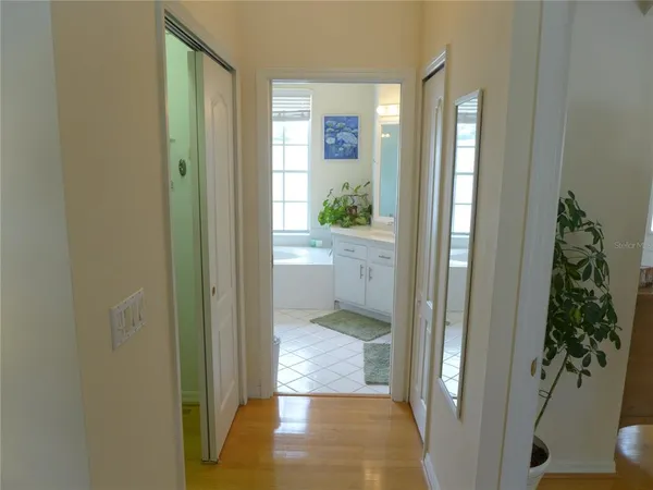 a view of entryway with window and wooden floor