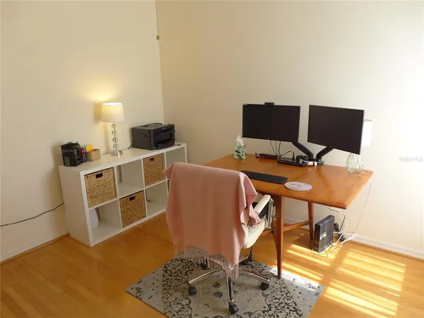 a workspace with furniture and lamp