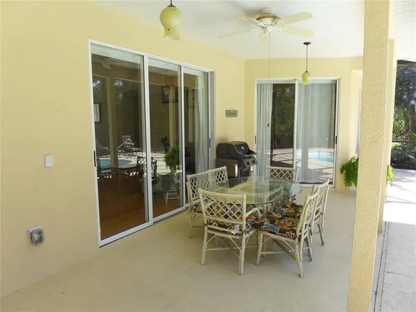a dining room with furniture and window