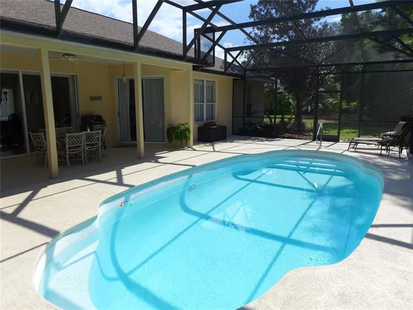 a view of a patio with swimming pool